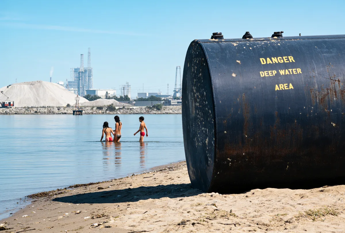 The same slide restored, with blue sky and the warning sign lettering intact