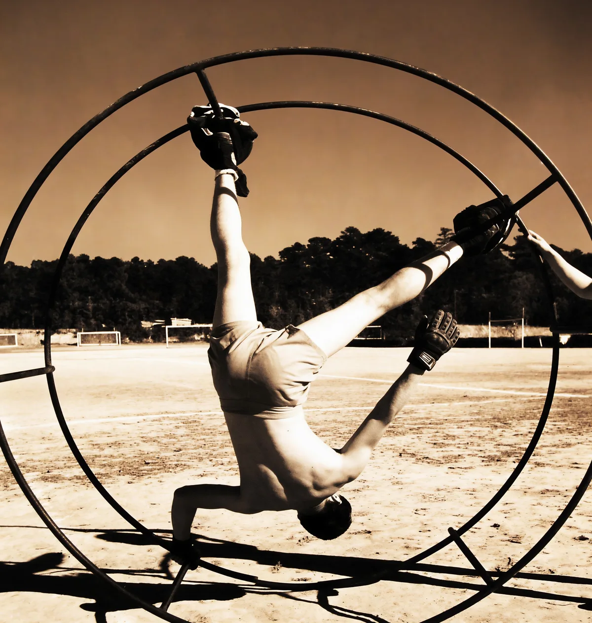 The repaired photo, where the gymnast's grip and pose differ from the original