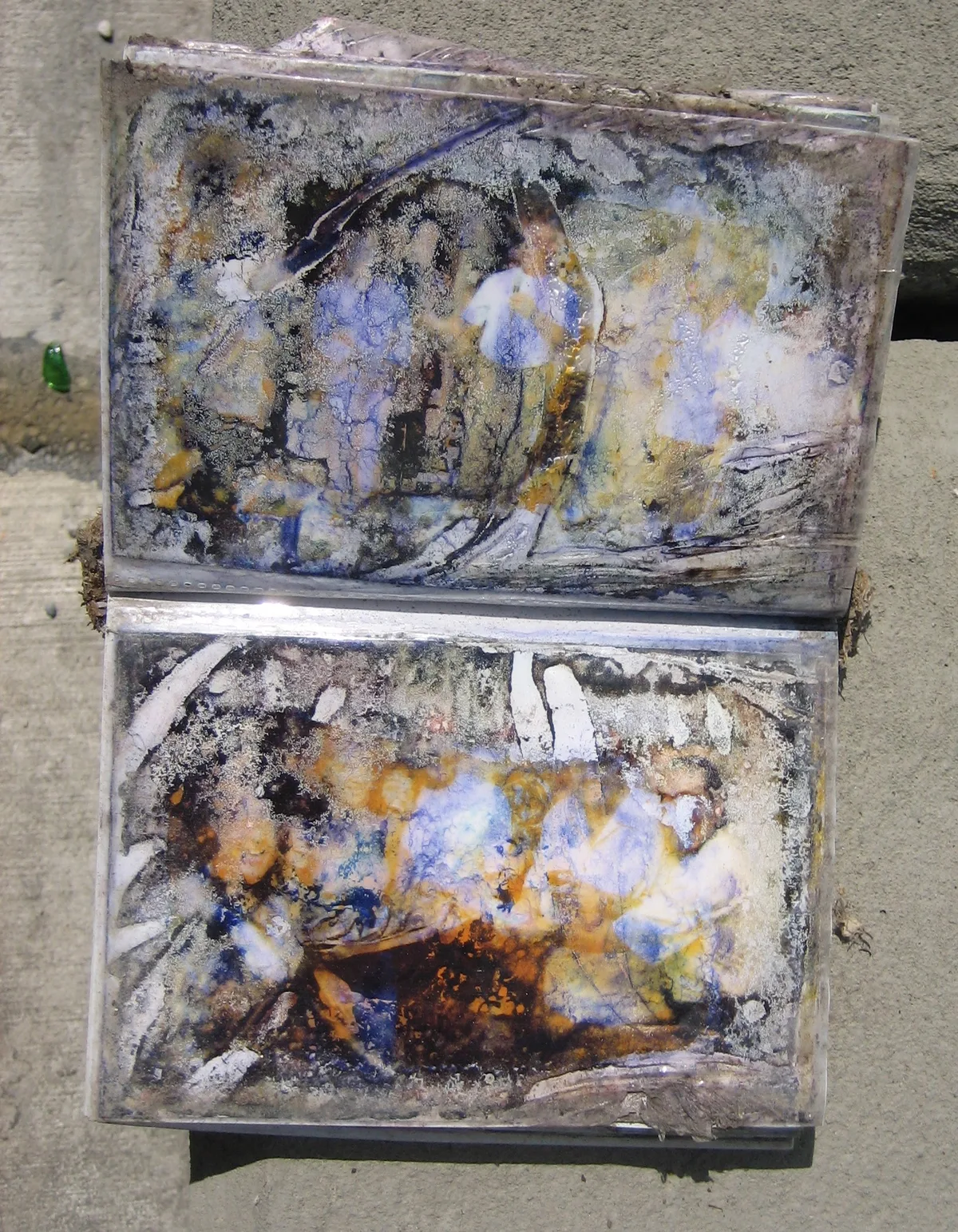 Album pages caked in silt after Katrina floodwater, images destroyed